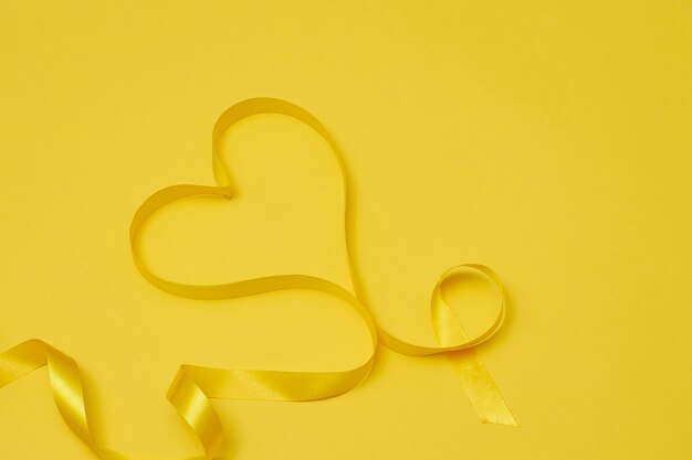 Yellow ribbon on yellowish background