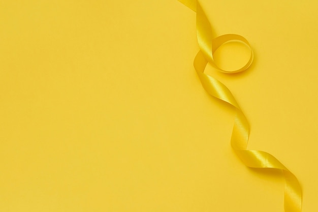 Yellow ribbon on yellowish background