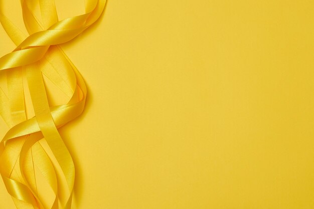 Yellow ribbon on yellowish background