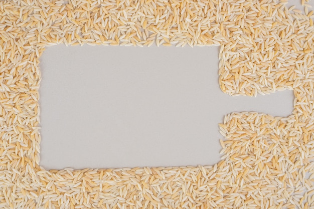 Free photo yellow rice isolated on concrete.