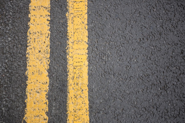 Yellow road marking on road surface