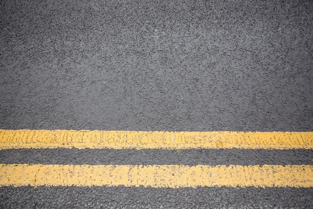 Free photo yellow road marking on road surface