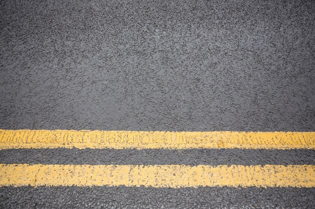 Yellow road marking on road surface