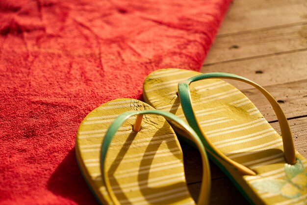 Yellow sandals on a red towel