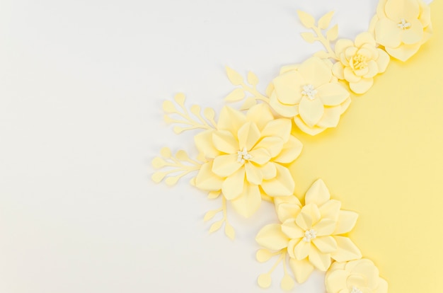 Yellow spring paper flowers on white background