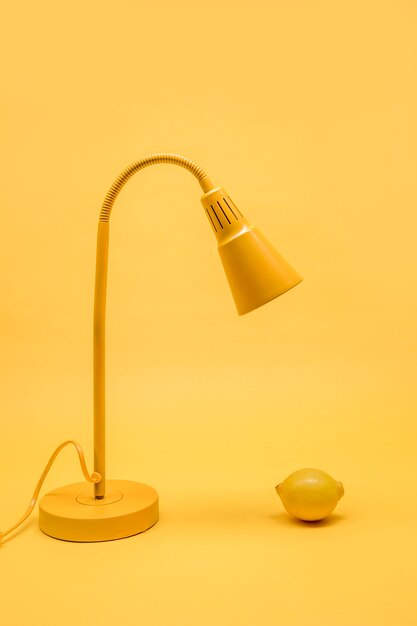 Yellow still life of lemon under lamp