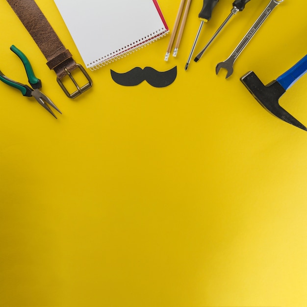 Yellow surface with variety of elements for father's day