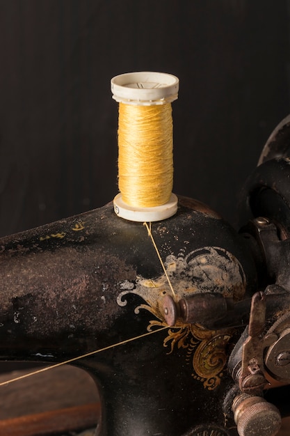 Free photo yellow thread on sewing machine