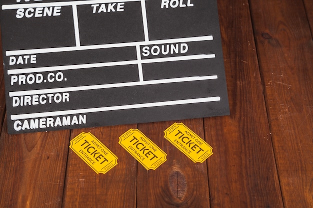 Free photo yellow tickets near clapperboard