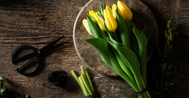 Yellow tulips on plate