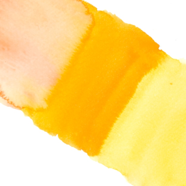 白い背景に分離された黄色の水彩画の洗浄テクスチャ