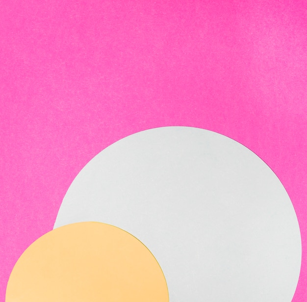 Yellow and white semi circle frame on pink background