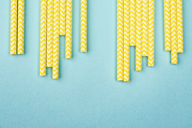 Free photo yellow with white stripes straws