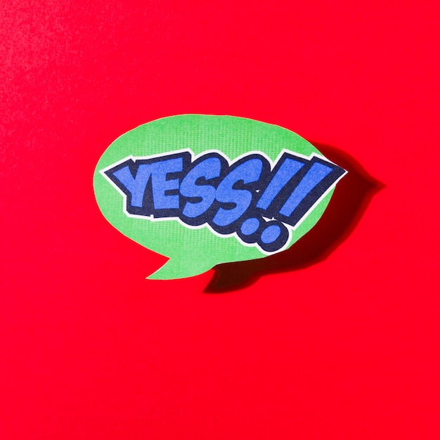 Free photo yes comic green speech bubble on red background