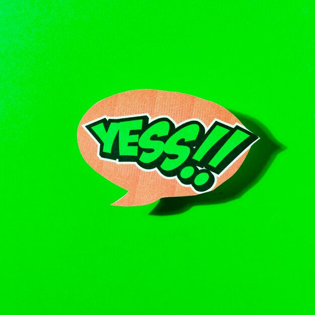 yes text in speech bubble on green background