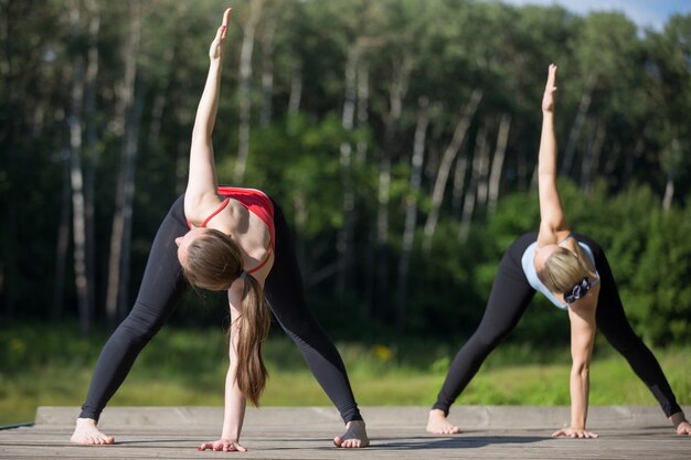 Yoga class: trikonasana pose