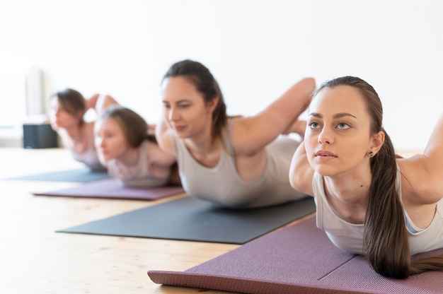 Yoga teacher teaching class