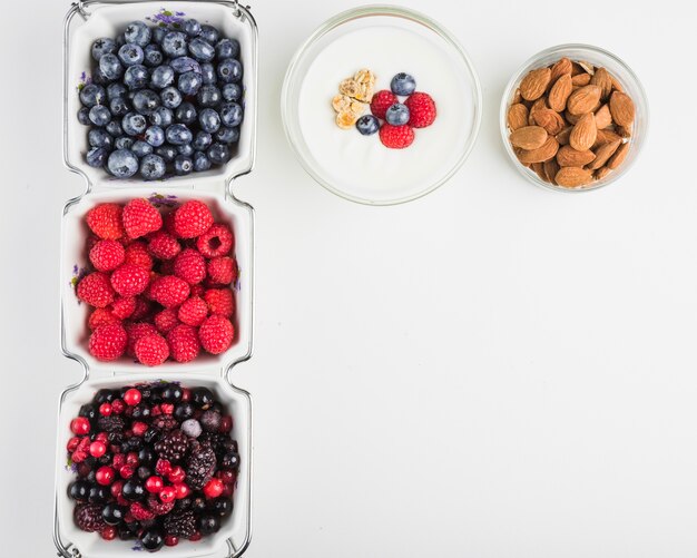 Yogurt near berries and almond