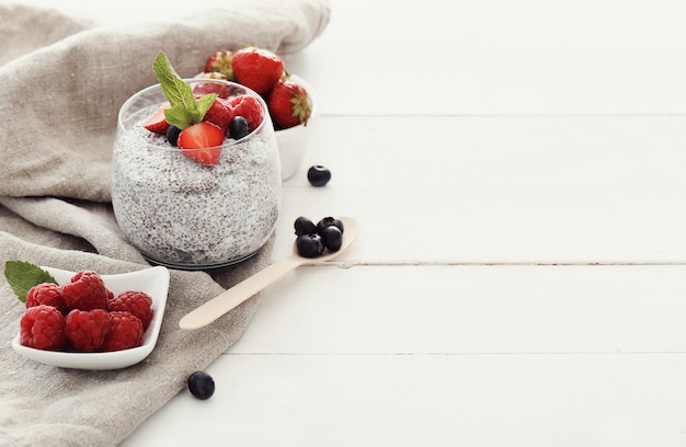 Yogurt with chia seed and berries in glass