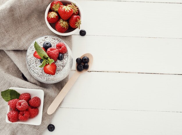 Yogurt with chia seed and berries in glass