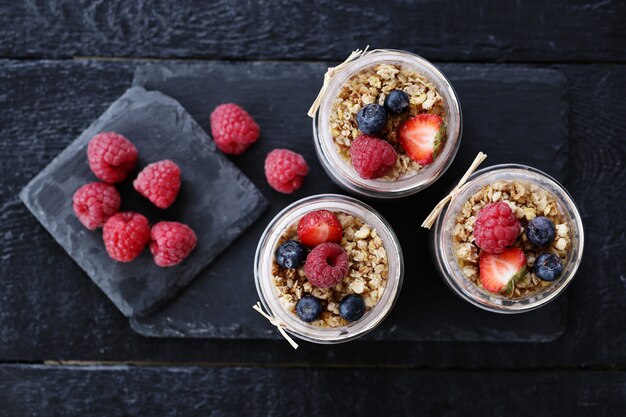 Yogurt with chia seed and berries in glasses