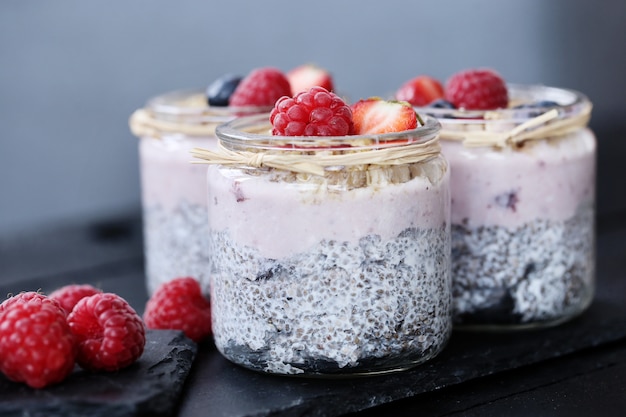 Yogurt with chia seed and berries in glasses