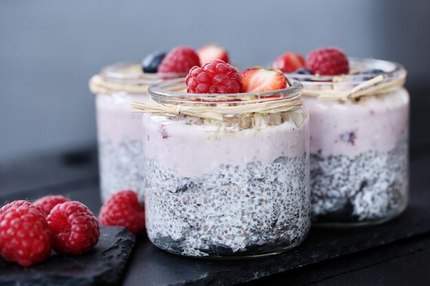 Yogurt with chia seed and berries in glasses