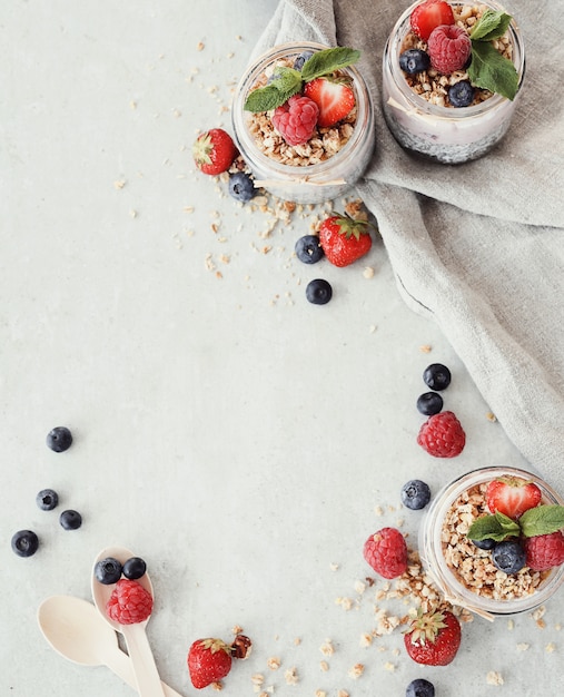 Yogurt with chia seed and berries in glasses