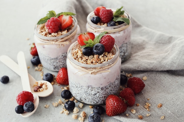 Yogurt with chia seed and berries in glasses