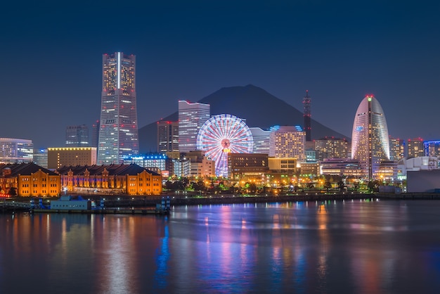 Premium Photo  Yokohama city skyline over the mt fuji at sunset time