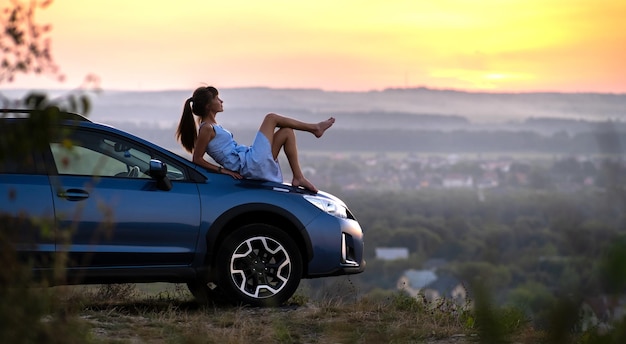 On a car hood, in nature