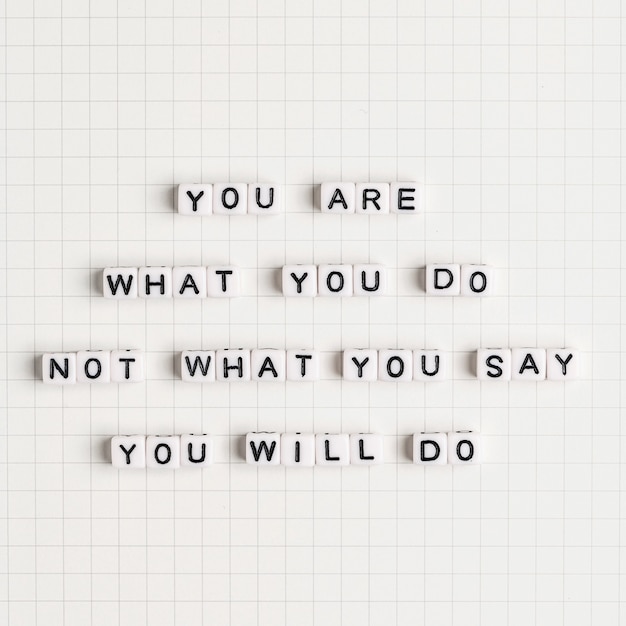 YOU ARE WHAT YOU DO NOT WHAT YOU SAY YOU WILL DO beads message typography