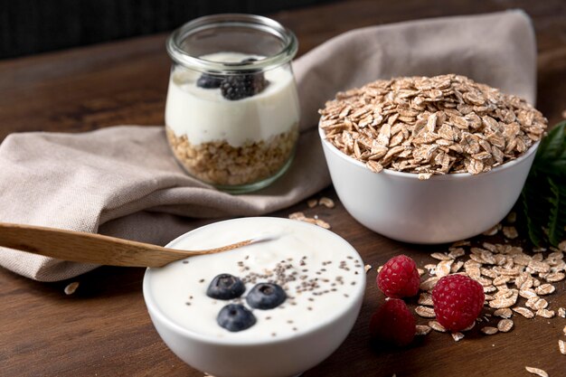 Yougurt with granola and fruits on desk