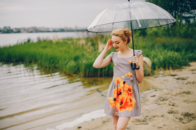 Yound and pretty girl in a summer park