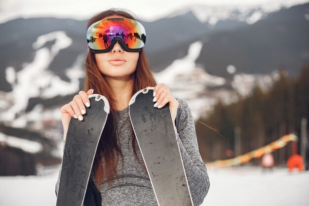young and active brunette skiing. woman in the snowy mountains.