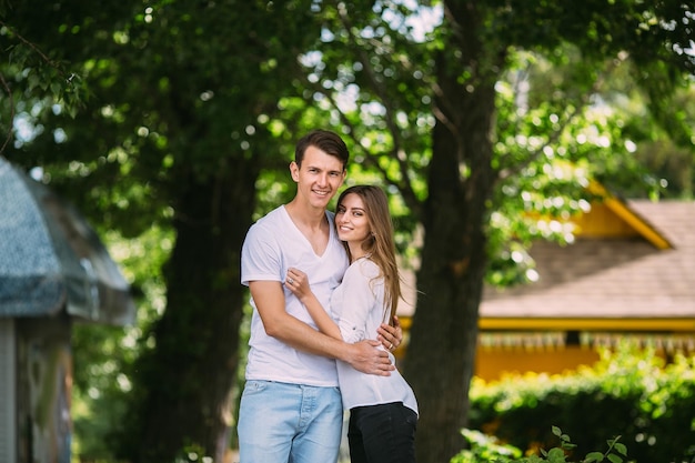 Young adult brunette man and woman in the park