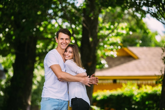 Young adult brunette man and woman in the park