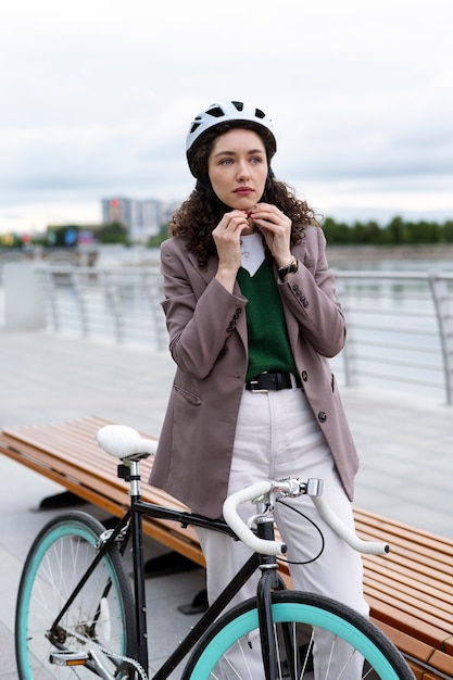 Free photo young adult cycling to work in the city
