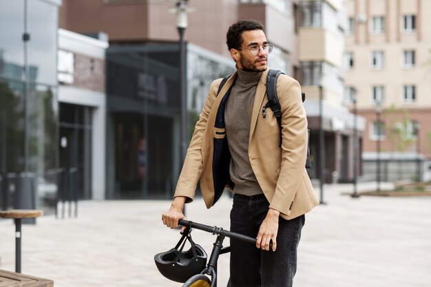 Young adult cycling to work in the city