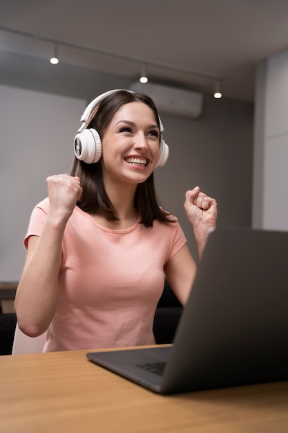 Young adult enjoying playing video game