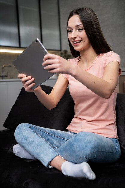 Free photo young adult enjoying playing video game