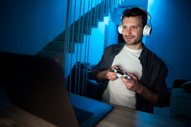 young adult enjoying playing video game