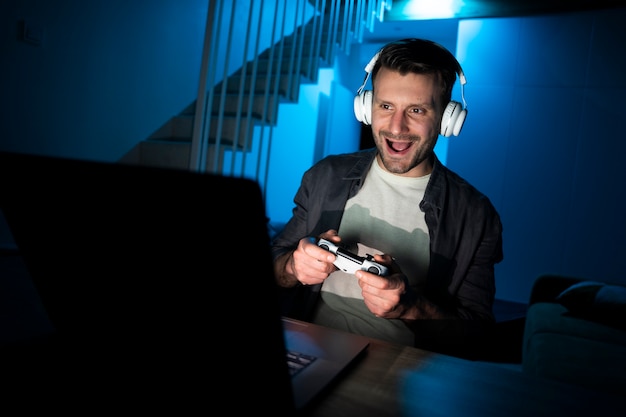 Young adult enjoying playing video game