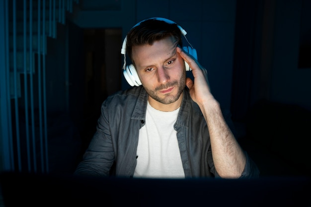 Young adult enjoying playing video game