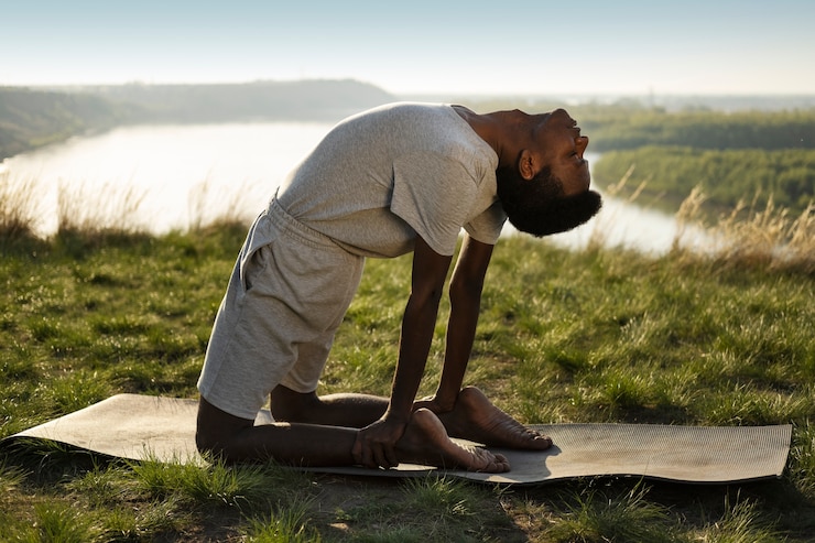 Free Photo young adult enjoying yoga in nature
