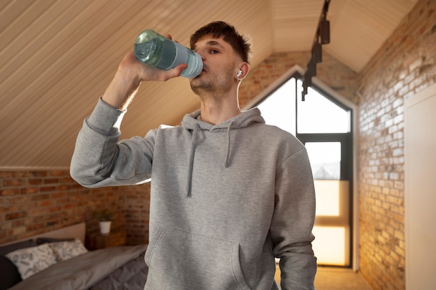 Young adult exercising at home