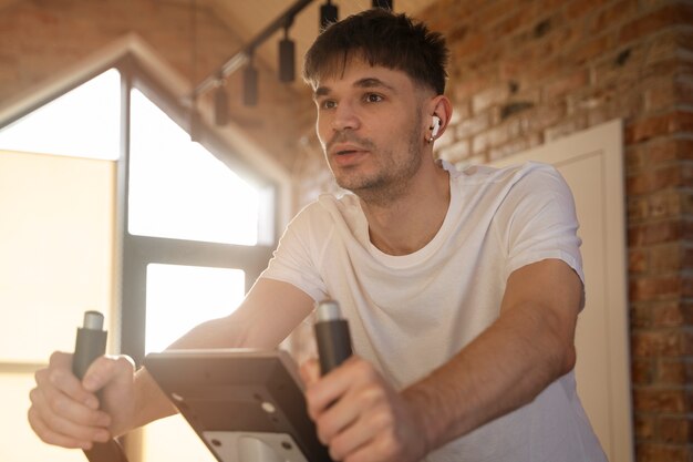 Free photo young adult exercising at home