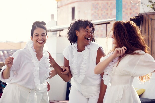 Young adult having fun at white party