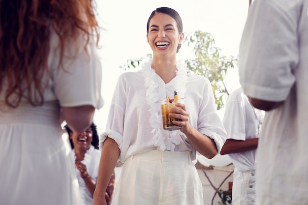 Young adult having fun at white party