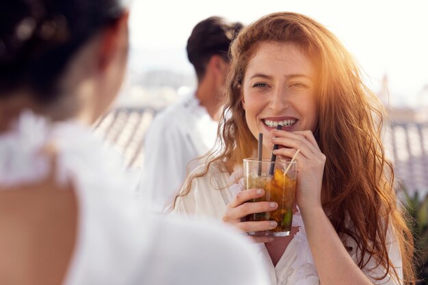 Young adult having fun at white party